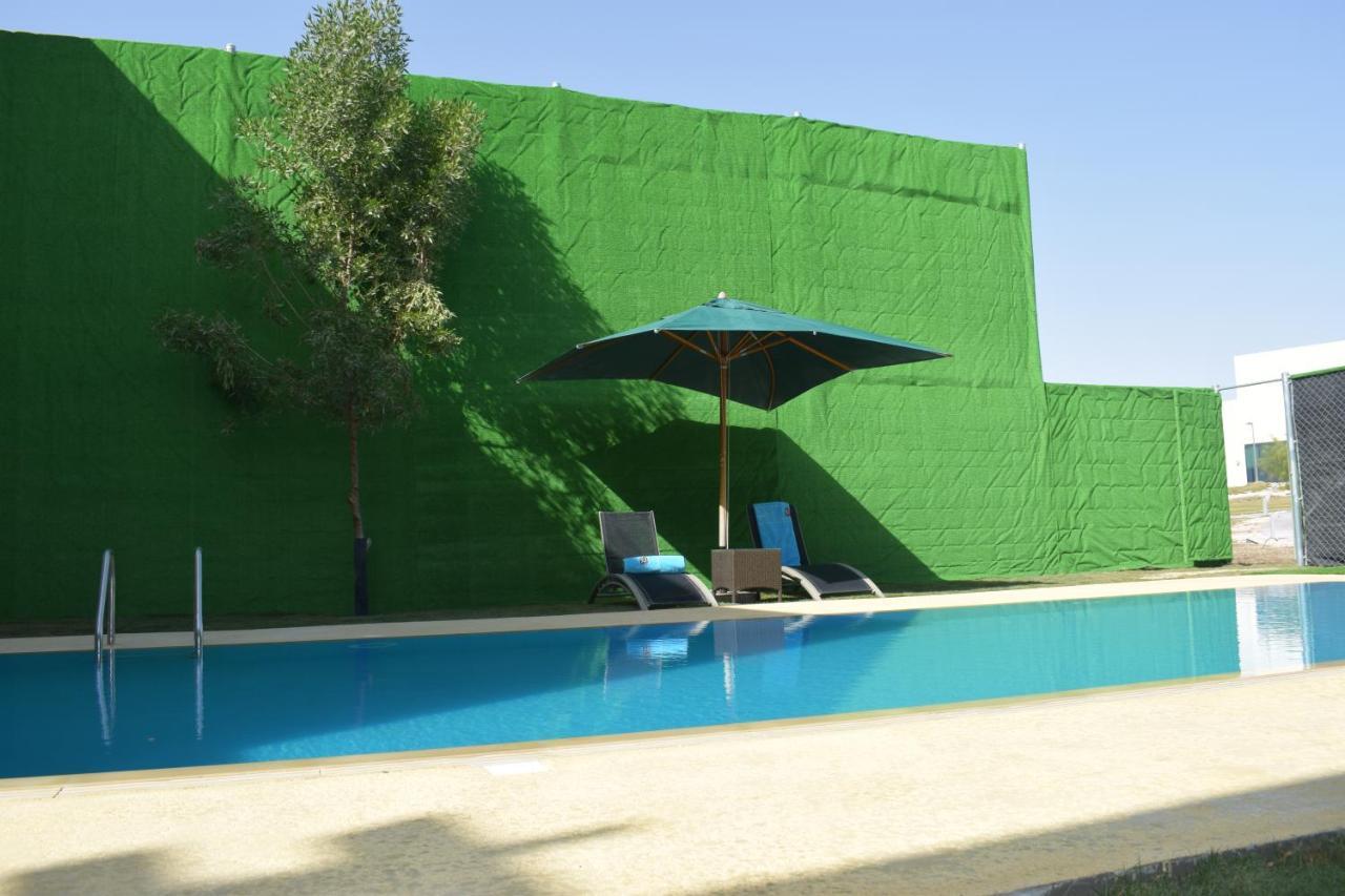 Retaj Salwa Resort & Spa Ντόχα Εξωτερικό φωτογραφία A swimming pool in Spain